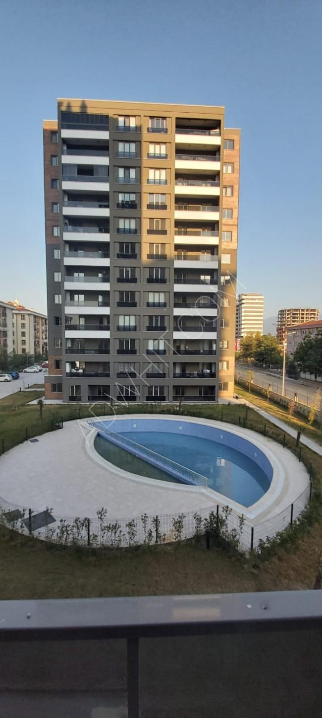 شقة جديدة للبيع 3غرف وصالة في مدينة بورصة  التركيا منطقة عثمان غازي  يونسلي 